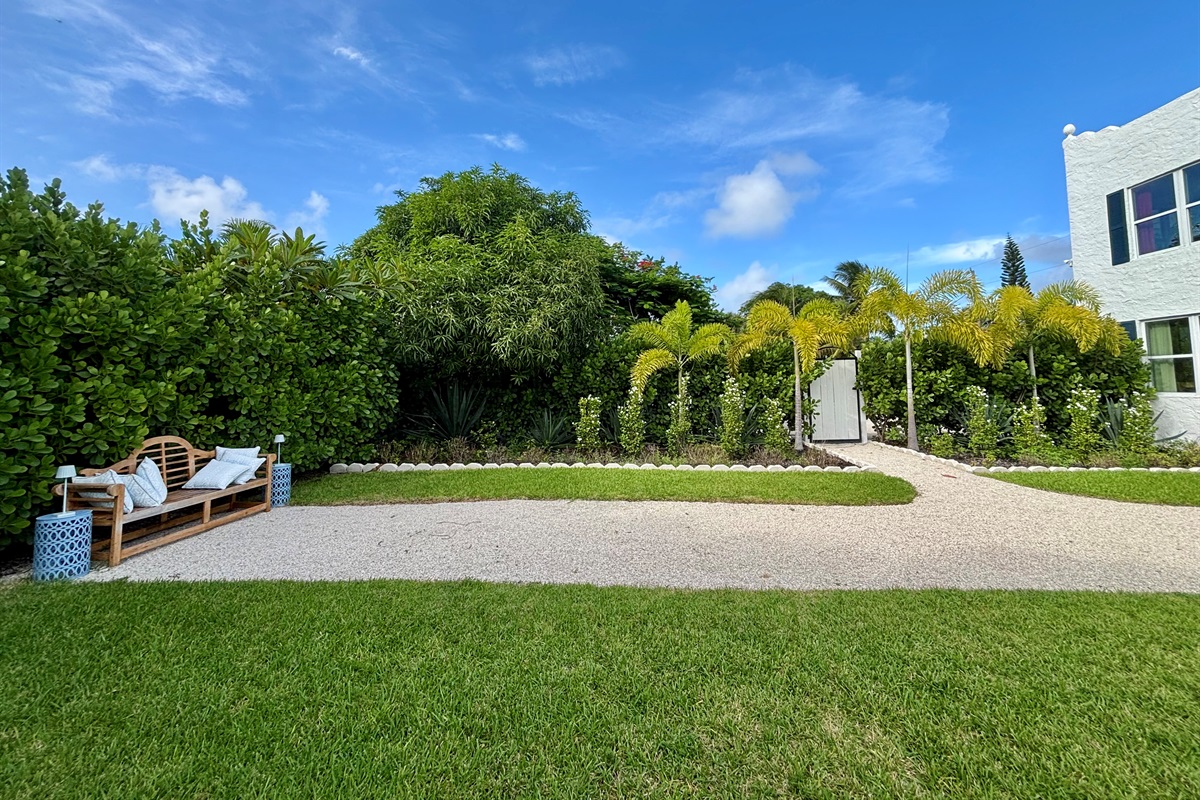 The garden of The Marisol features a spacious lawn, a walking path, hand-selected plantings and cozy, relaxing seating areas to take in the full beauty of the grounds.