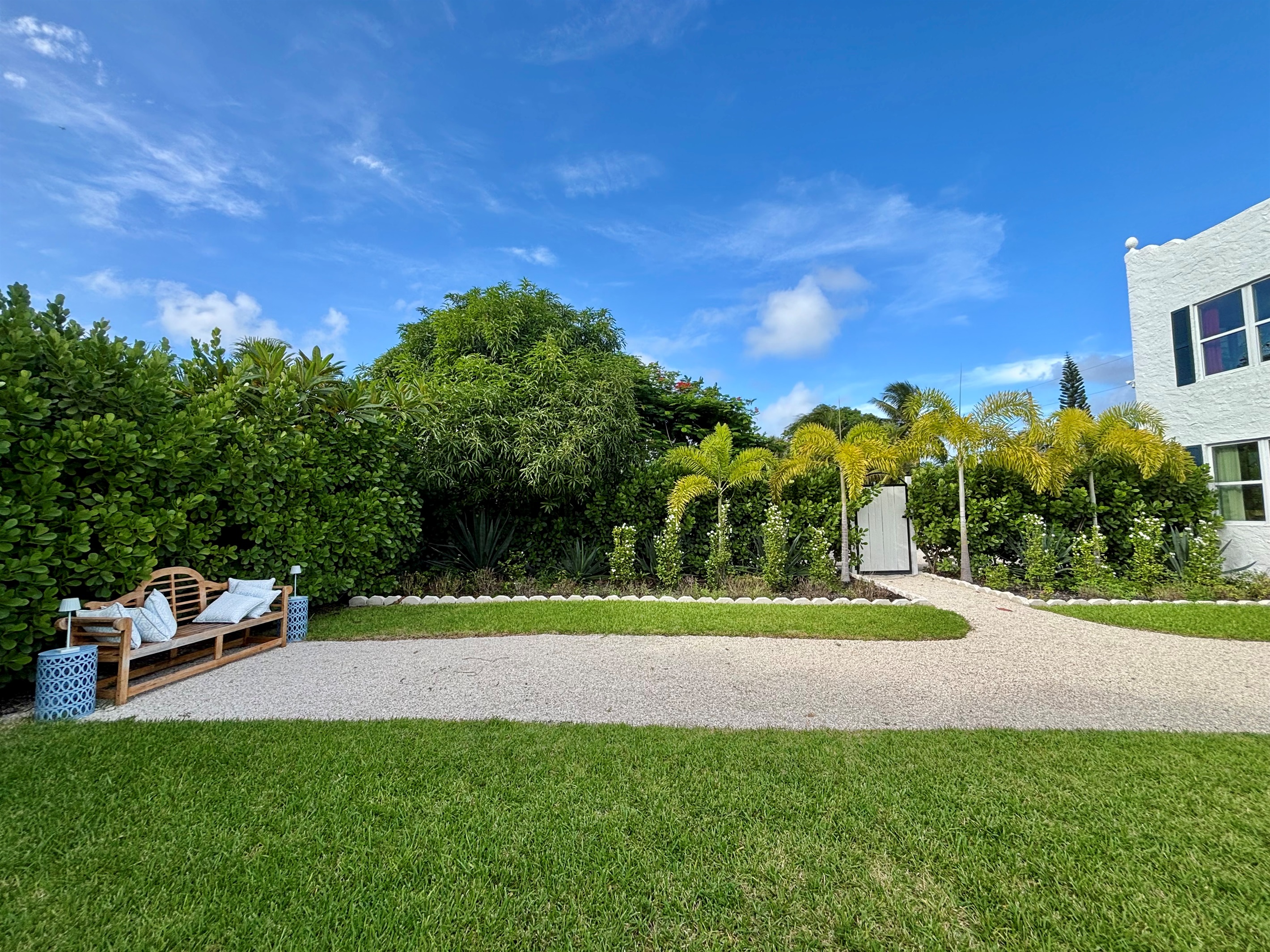 The garden of The Marisol features a spacious lawn, a walking path, hand-selected plantings and cozy, relaxing seating areas to take in the full beauty of the grounds.
