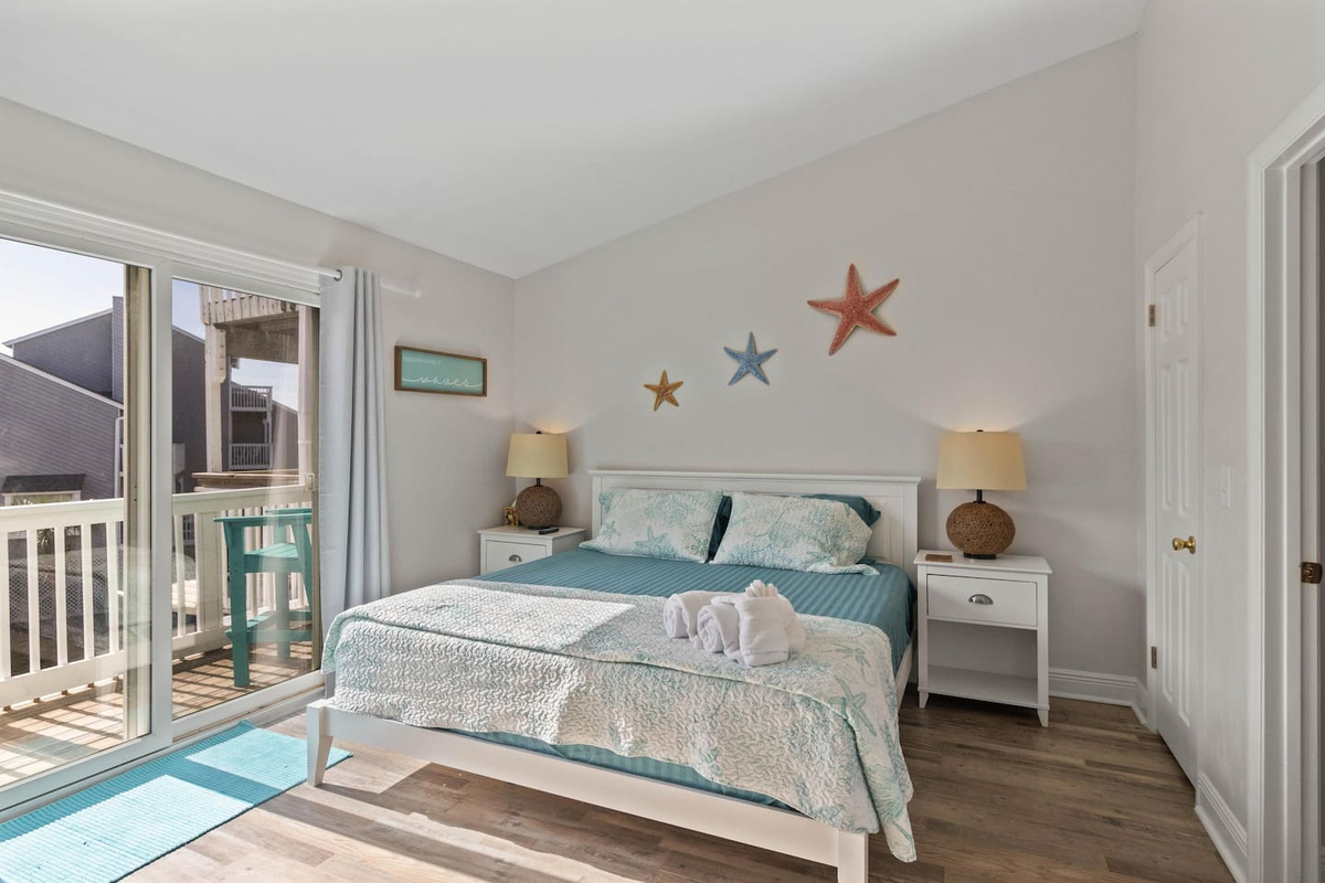 Wake up to Gulf light streaming through the deck door &mdash; king bed, private balcony, alarm strictly optional.