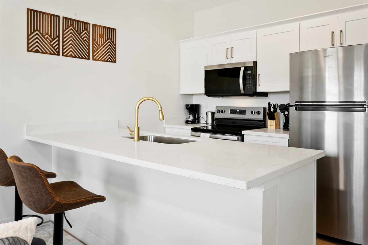 Large quartz countertop - doubles as dining and workspace