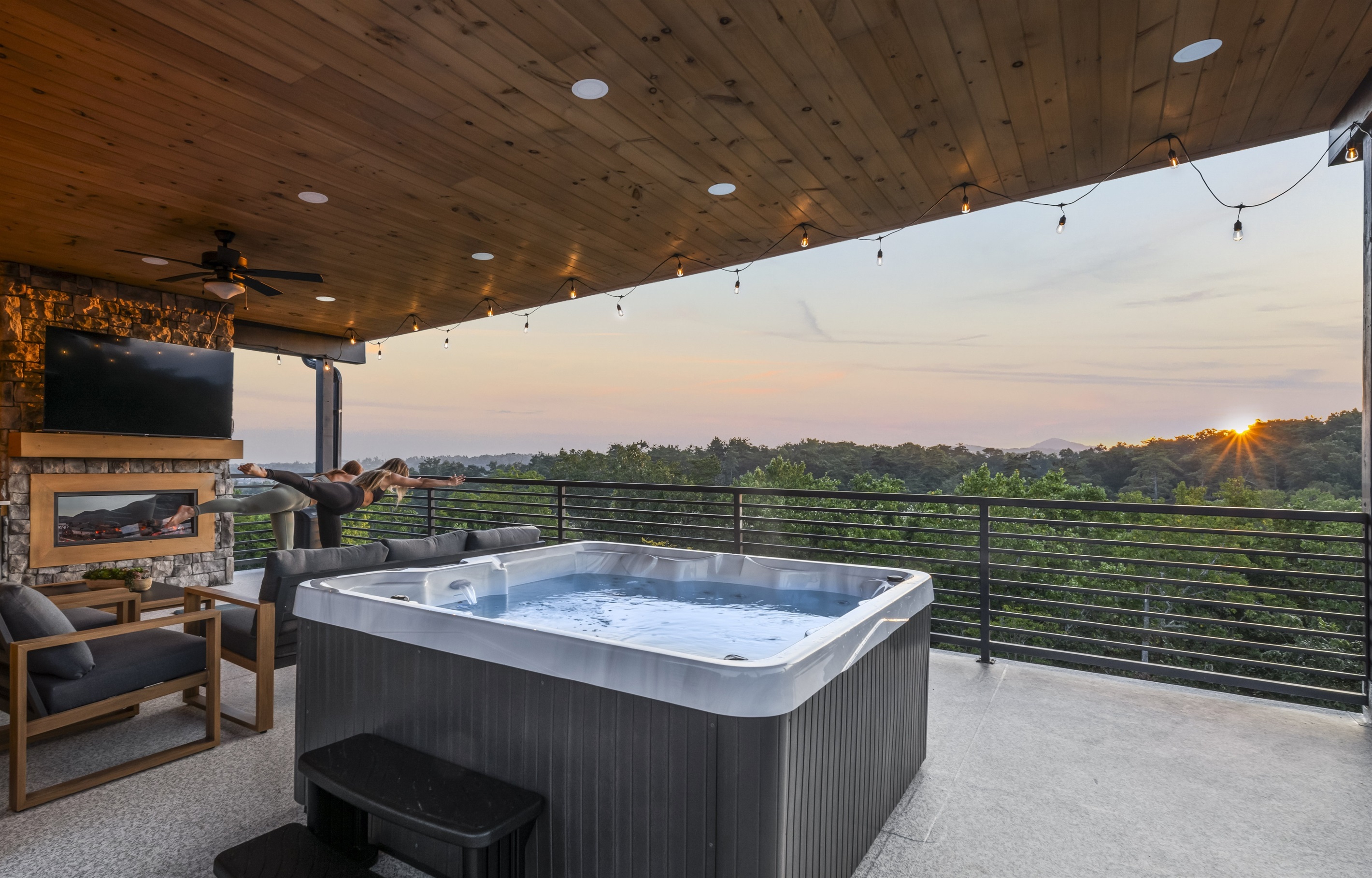 Private rooftop terrace with hot tub, fireplace, and breathtaking sunrise + mountain views.
