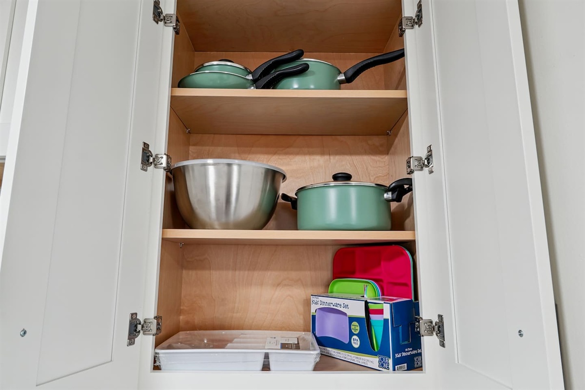 Full kitchen thoughtfully stocked with everything you may need including cookware, utensils, dishes, and essential appliances perfect for preparing meals and enjoying a true home-away-from-home experience.