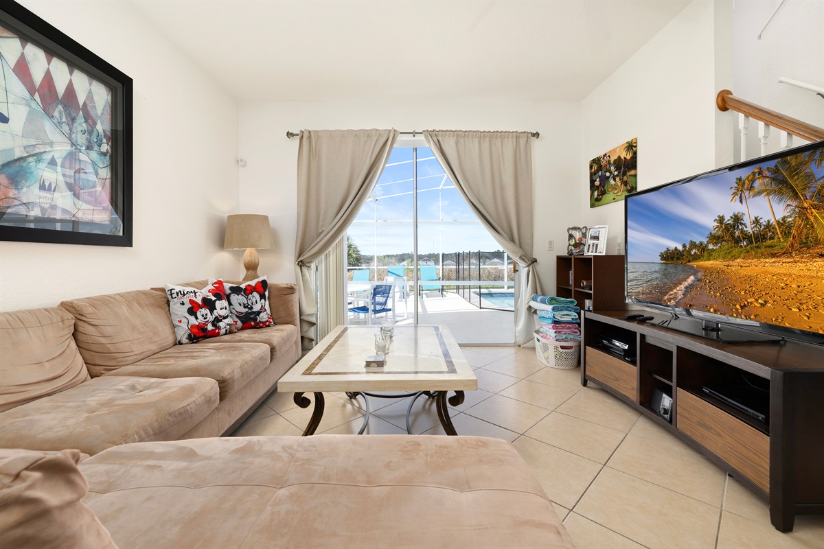 The sitting room is bathed in light from the pool deck doors!
