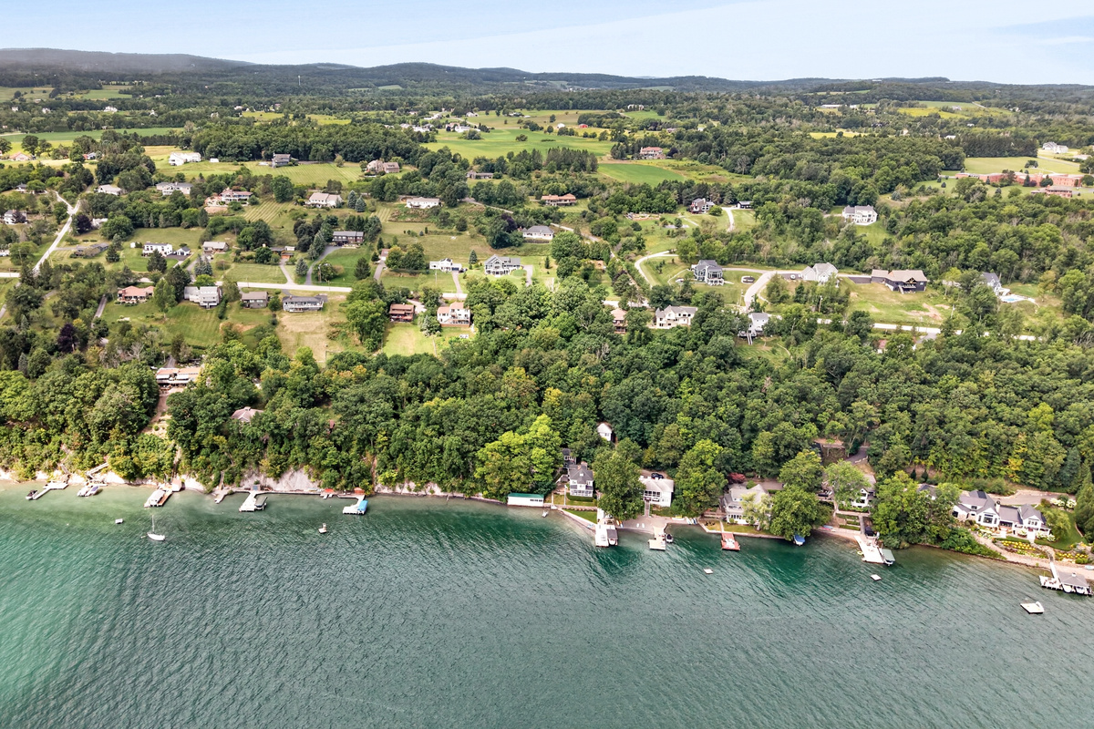 Homes lining the tree-covered waterfront
