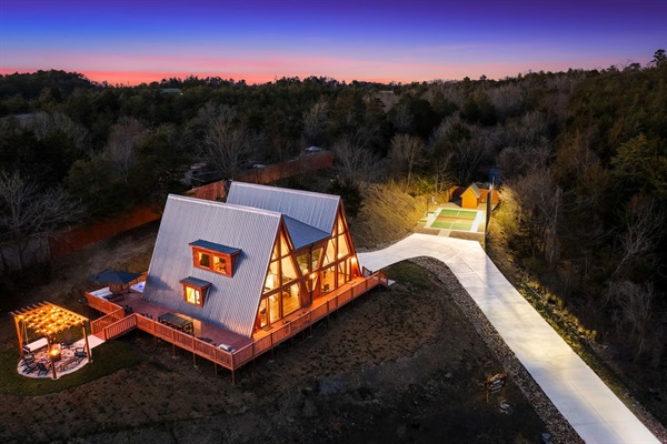 Exterior Retreat: Enchanting cabin with mountain views, a fire pit, and a charming outdoor deck!