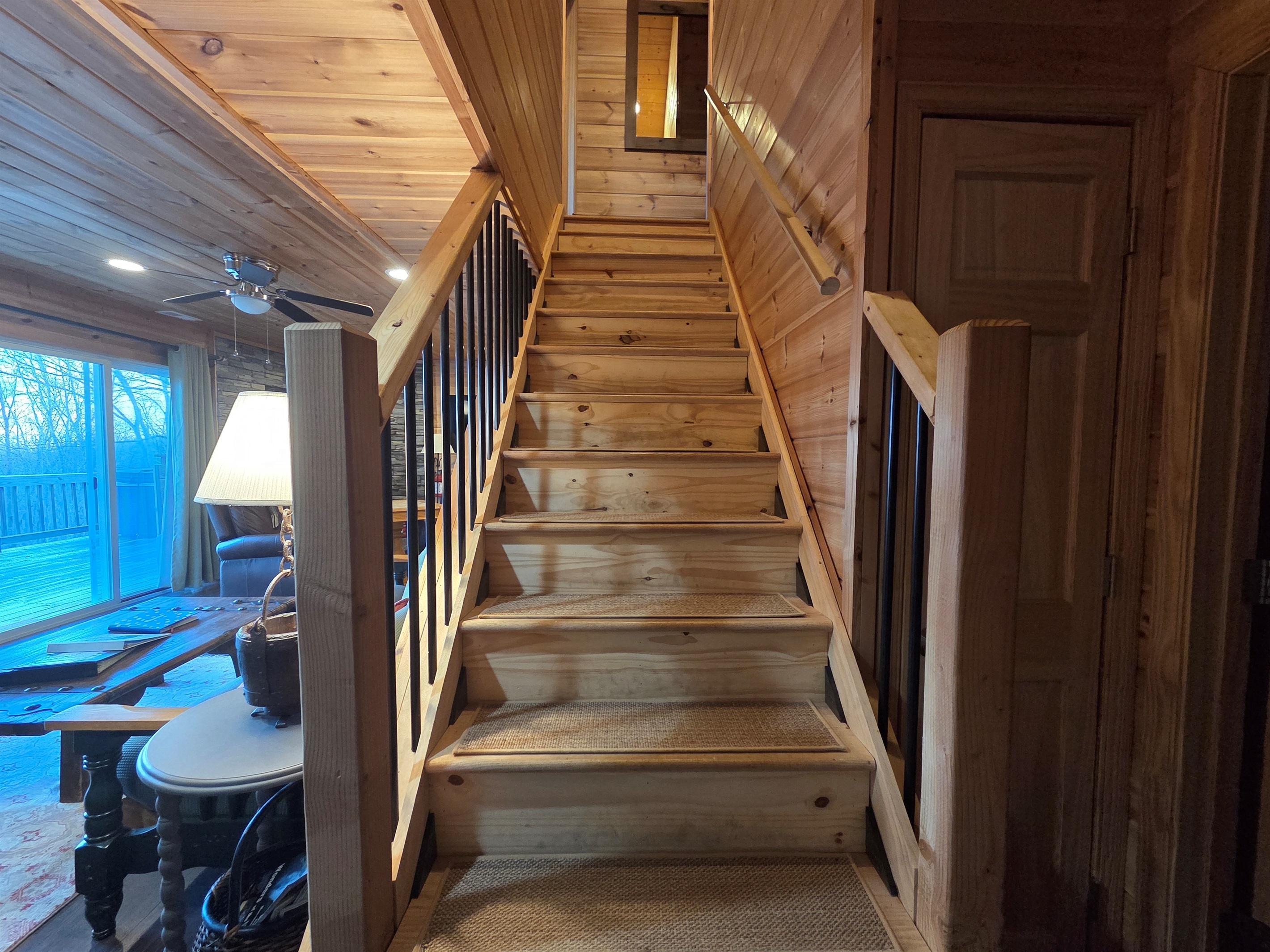 A set of steps leads to the upstairs bedrooms and bathroom.