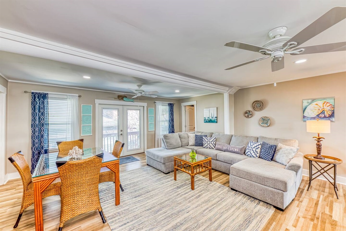 Living Room: Inviting space with soft lighting, plush seating, and charming coastal decor awaits!