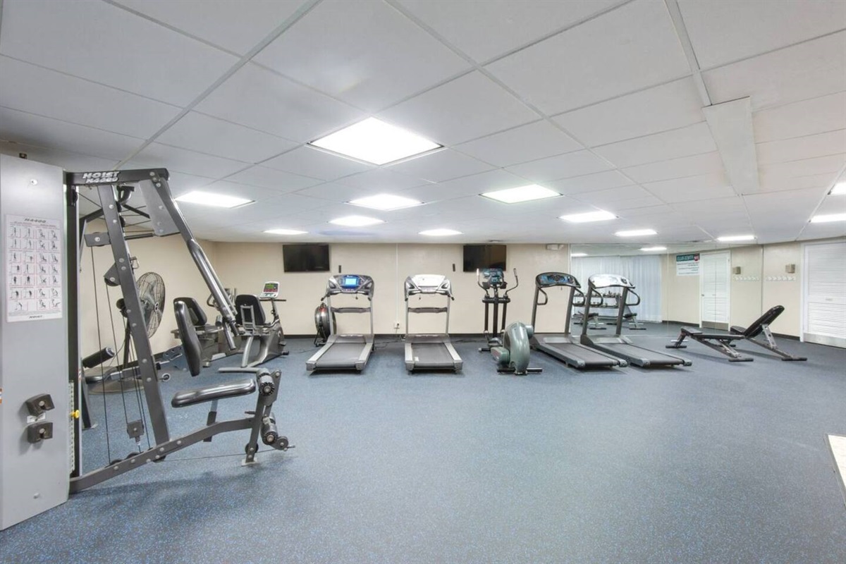 Well equipped, spacious fitness center at Holiday Surf & Racquet Club