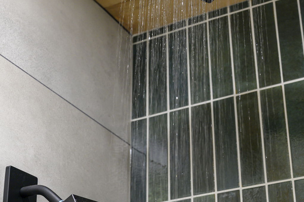 Bunk room walk in shower with rain shower head 