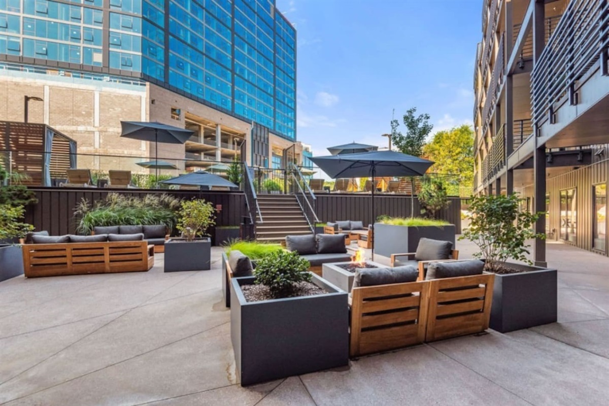 Lower pool deck patio area - tons of seating - public area in the building and guests are encouraged to use during their stay with us!