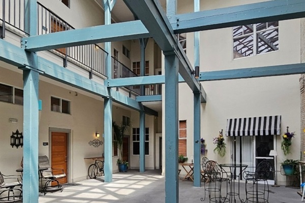 Atrium view of our patio - following the striped awning!
