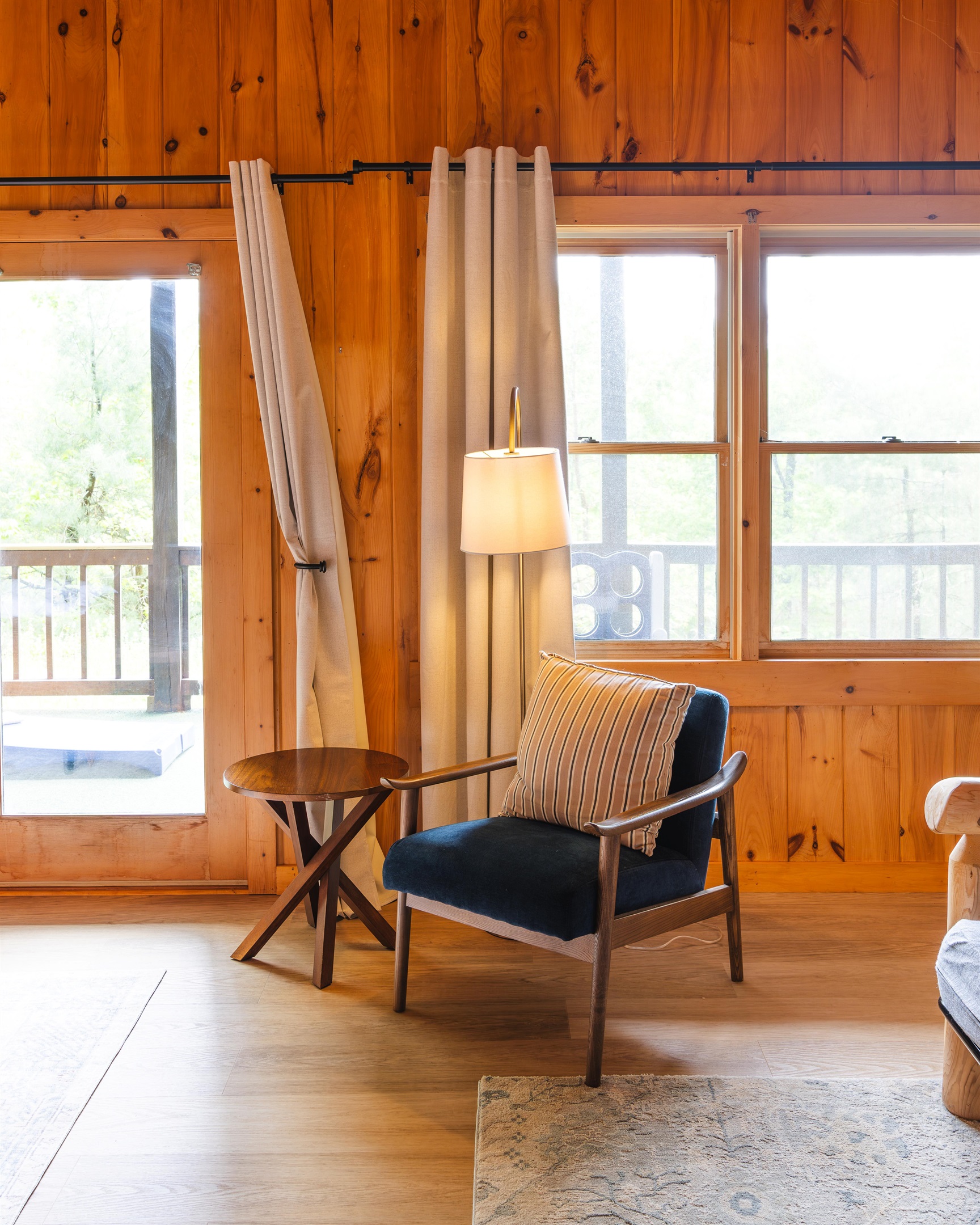 Curl up with a book as natural light fills the room and the forest sets the backdrop just outside the window.