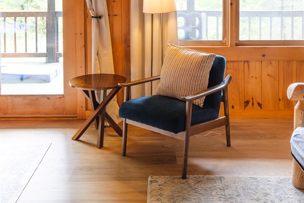 Curl up with a book as natural light fills the room and the forest sets the backdrop just outside the window.