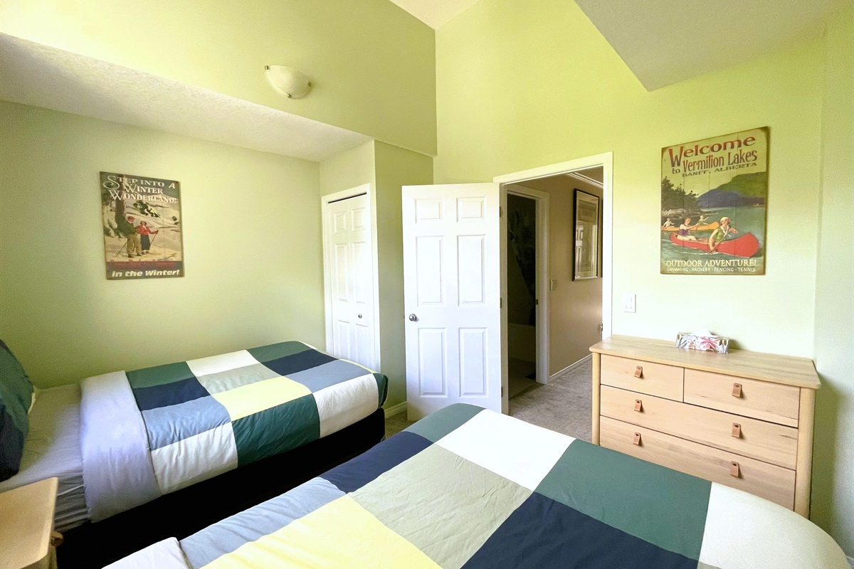 Guest bedroom with, two double beds. Vaulted ceilings and light blocking curtains. Adjacent bathroom in hallway. Located on 2nd floor.  