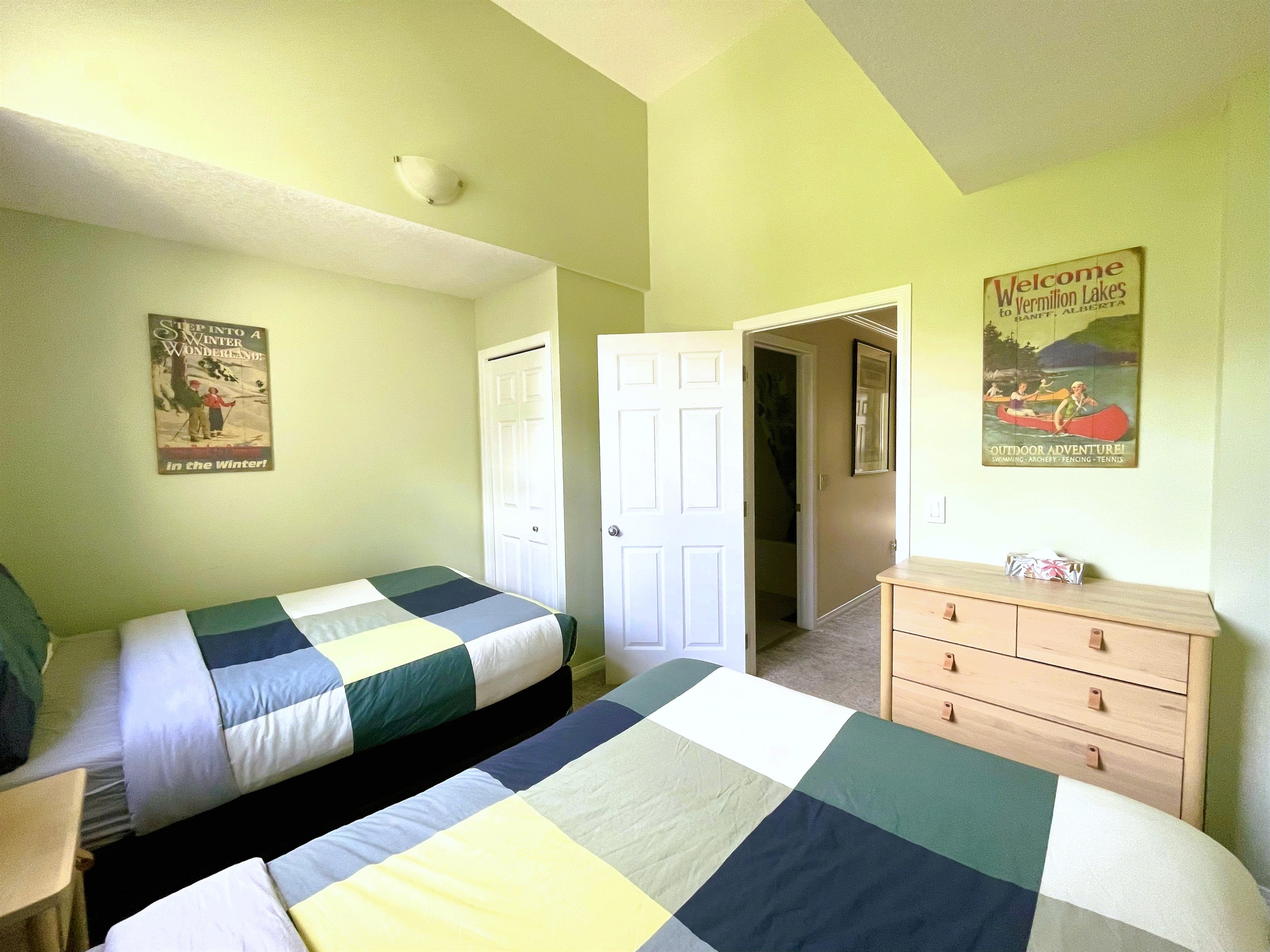 Guest bedroom with, two double beds. Vaulted ceilings and light blocking curtains. Adjacent bathroom in hallway. Located on 2nd floor.  