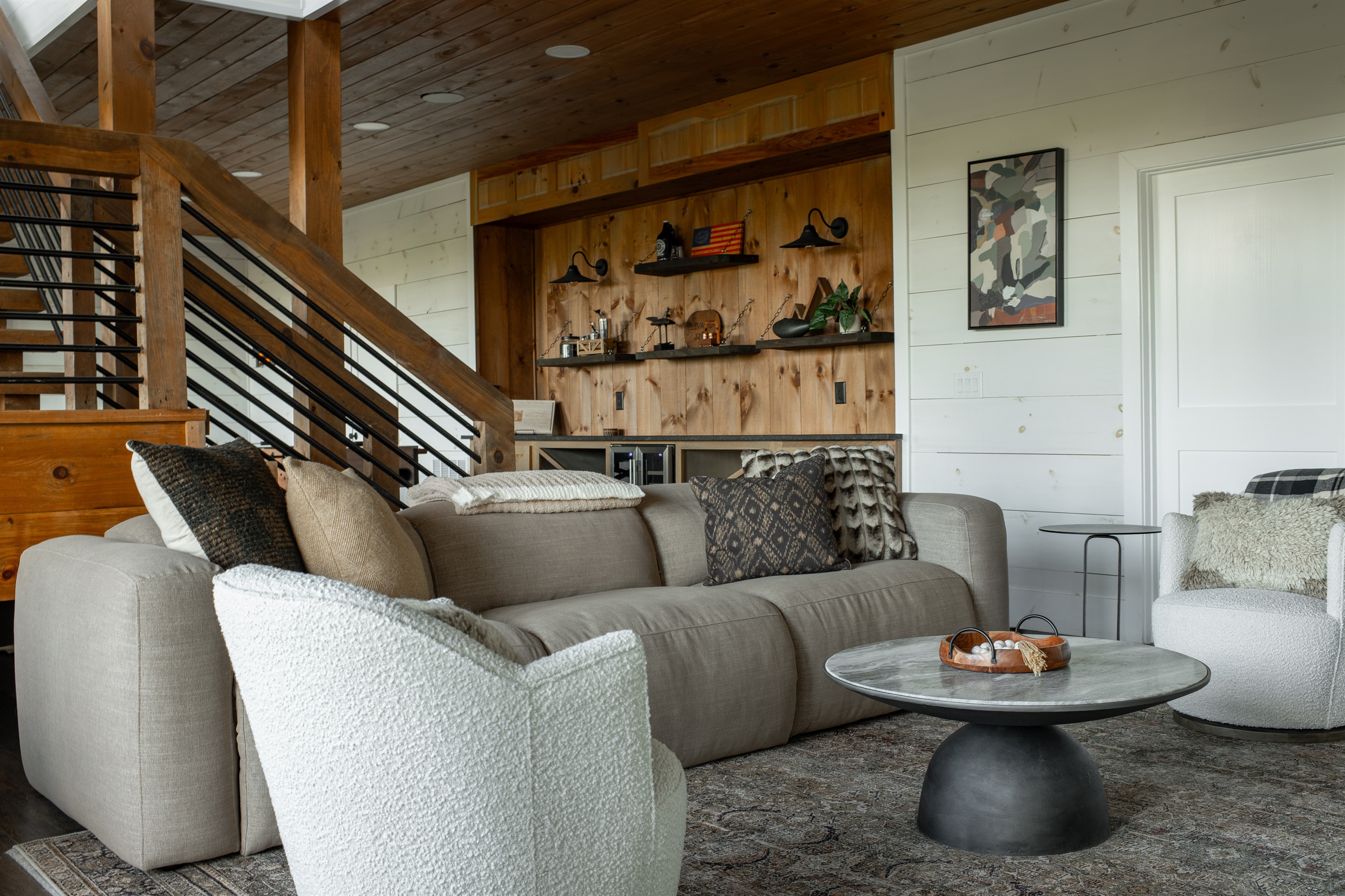 Lower Level | Relaxed gathering space with curated design and inviting seating