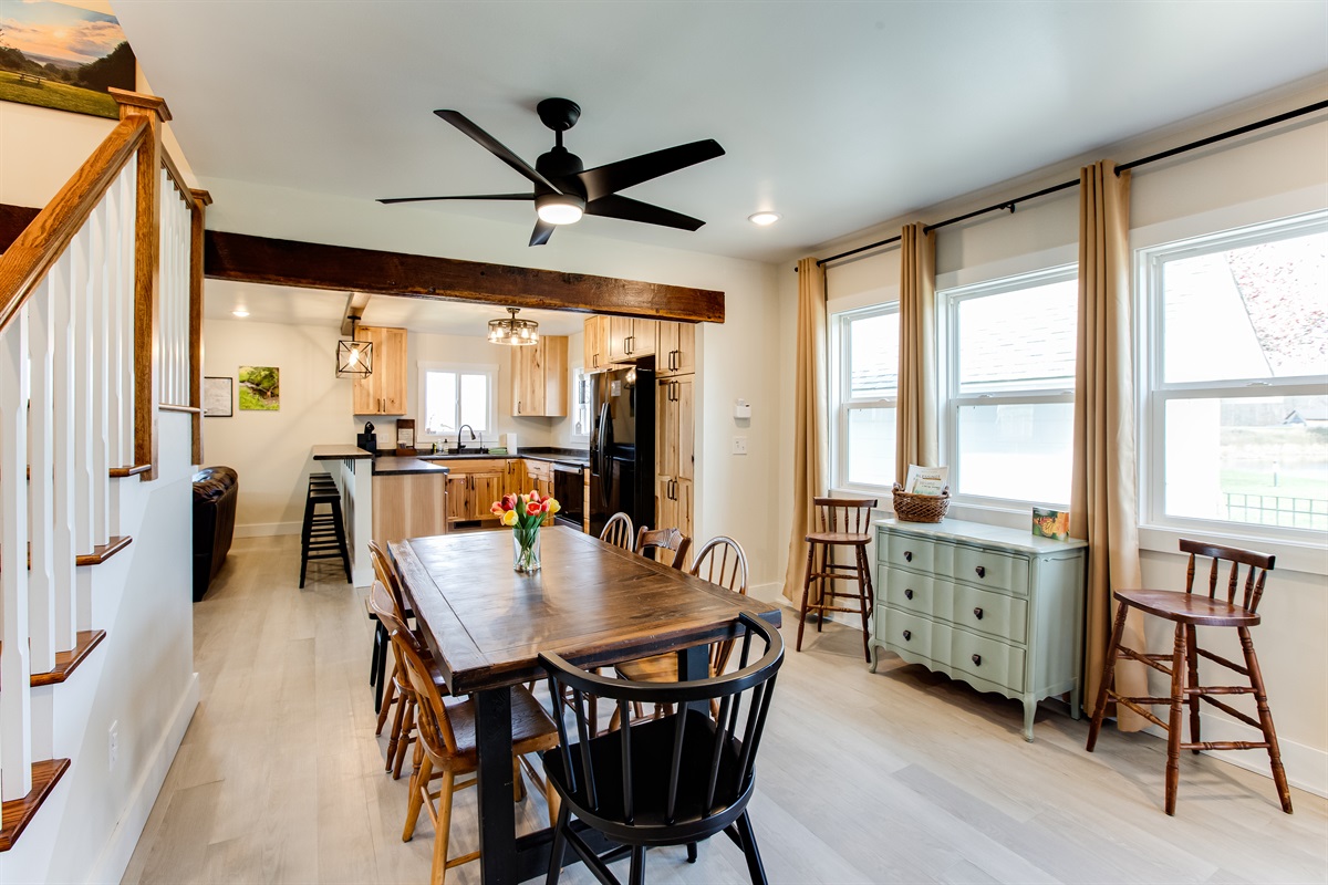 The Farmhouse is perfect for family dinners! The dining table comfortably seats 8, with two additional chairs available along the side of the room. There&rsquo;s also a high chair stored in the closet and seating for 4 more at the bar.