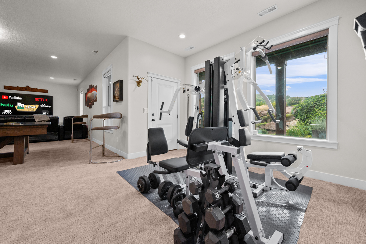 Stay active during your stay in the home's fully equipped fitness room with premium workout equipment.