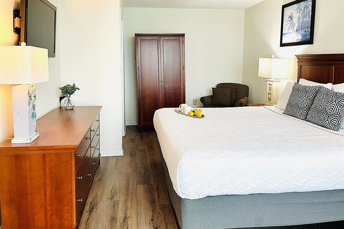 Drift into tranquility on a bed near the balcony of our oceanfront suite, where the gentle ocean breeze and stunning vistas create a peaceful haven.