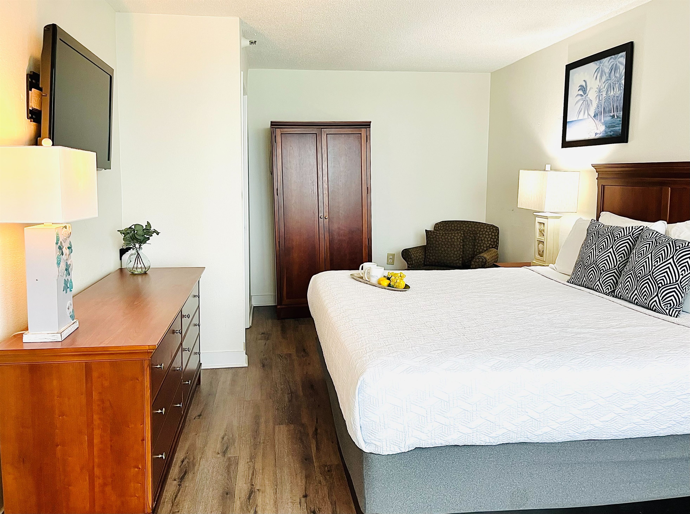 Drift into tranquility on a bed near the balcony of our oceanfront suite, where the gentle ocean breeze and stunning vistas create a peaceful haven.
