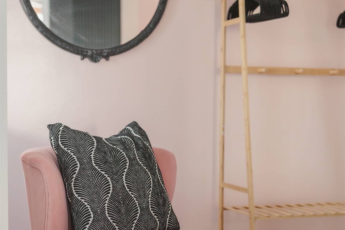 Getting ready feels like part of the vacation in this dreamy corner, with soft textures, curated decor, and a place to hang your favorite pieces before heading out for the evening.