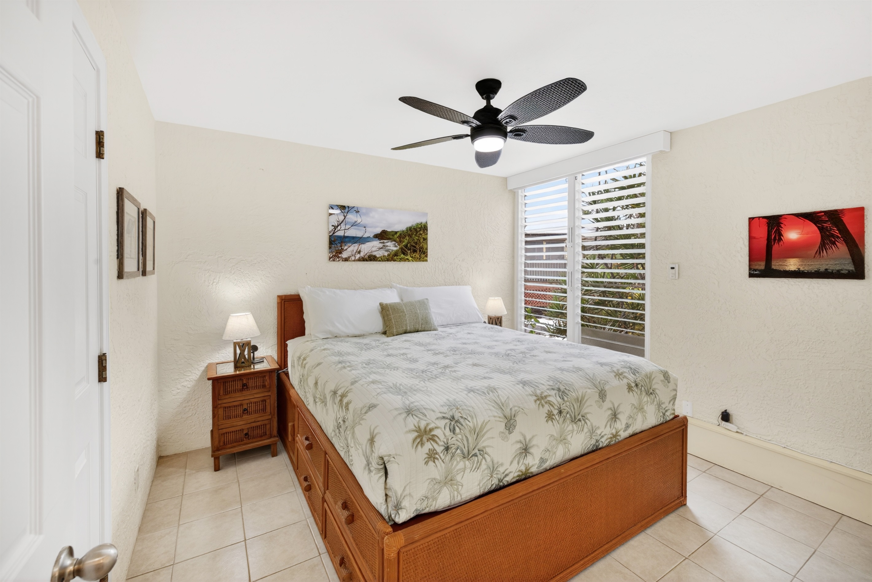 Spacious bedroom featuring a California King bed and A/C for cool, comfortable nights after a day in the sun.