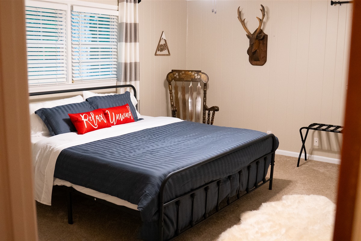 The upstairs king bedroom is comfortable, with a closet available for storage.