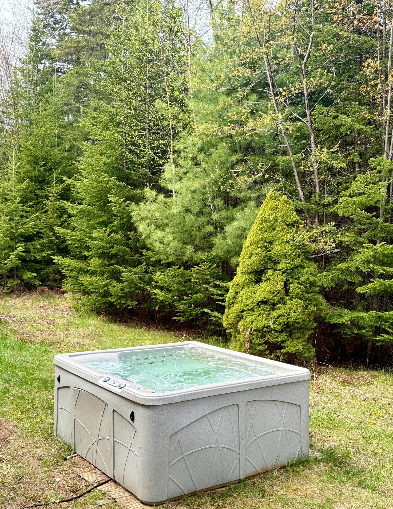 Nestled into the lush tree line of our private acreage, The Forest Well hot tub offers a secluded escape. It’s the perfect spot to soak in the "Quiet Side" serenity of Mount Desert Island after a day of exploring the nearby trails of Acadia National Park.