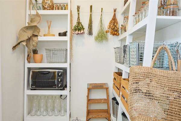 Kitchen storage + shelving, with lots of oils and dry goods that you're welcome to use