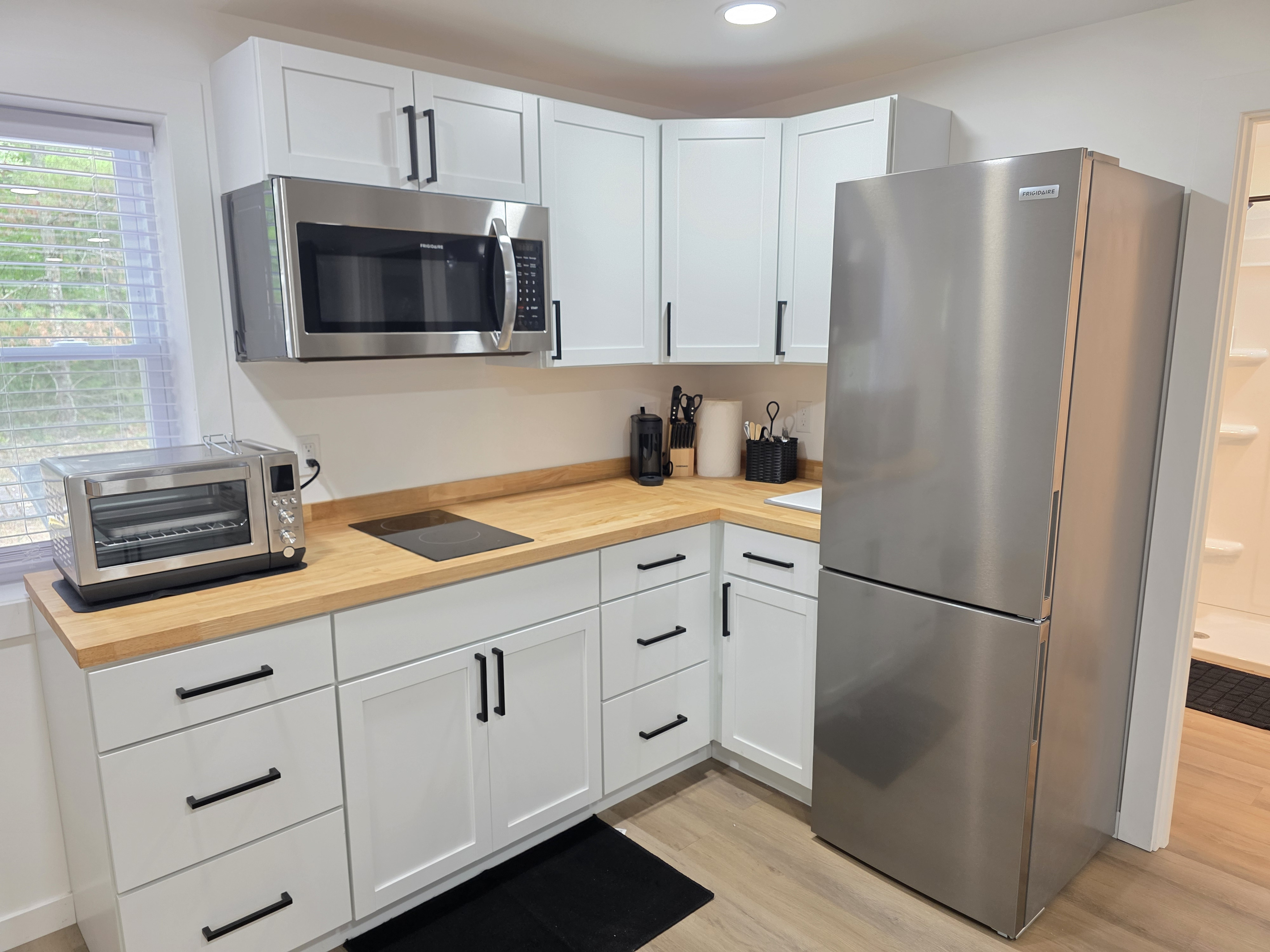 Kitchen with stainless steel appliances and toaster oven