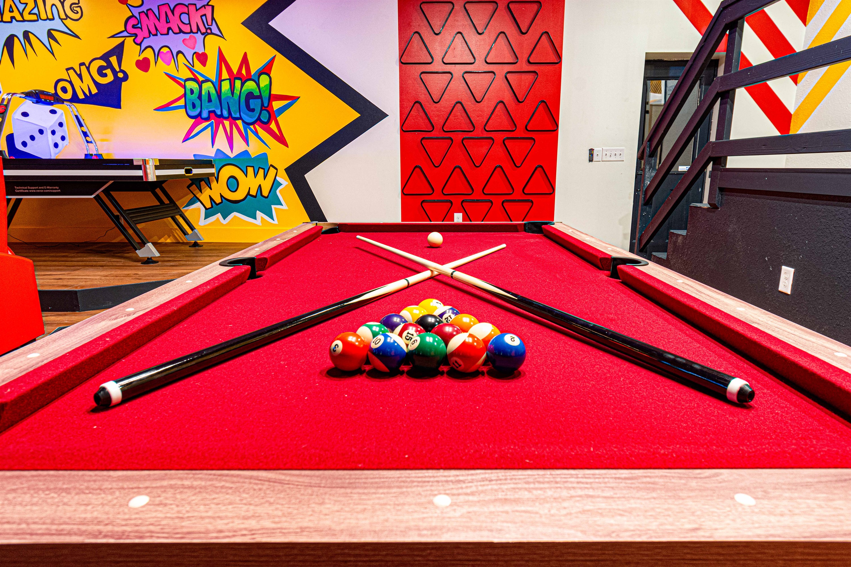 Challenge your friends to a game of pool in this vibrant and playful game room—where fun is always on the table!