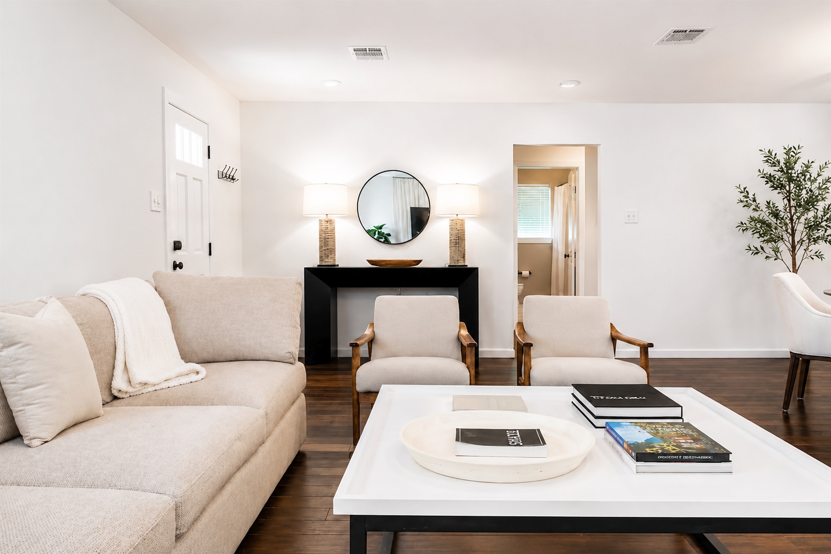 Warm and inviting lounge space with plush seating, elegant décor, and a bright airy layout
