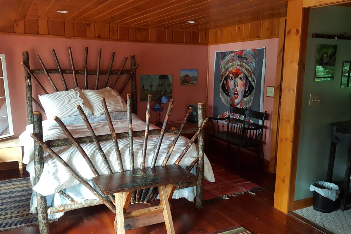 Primary bedroom with queen size bed. Bright and airy room with lake views and en suite bathroom attached.
