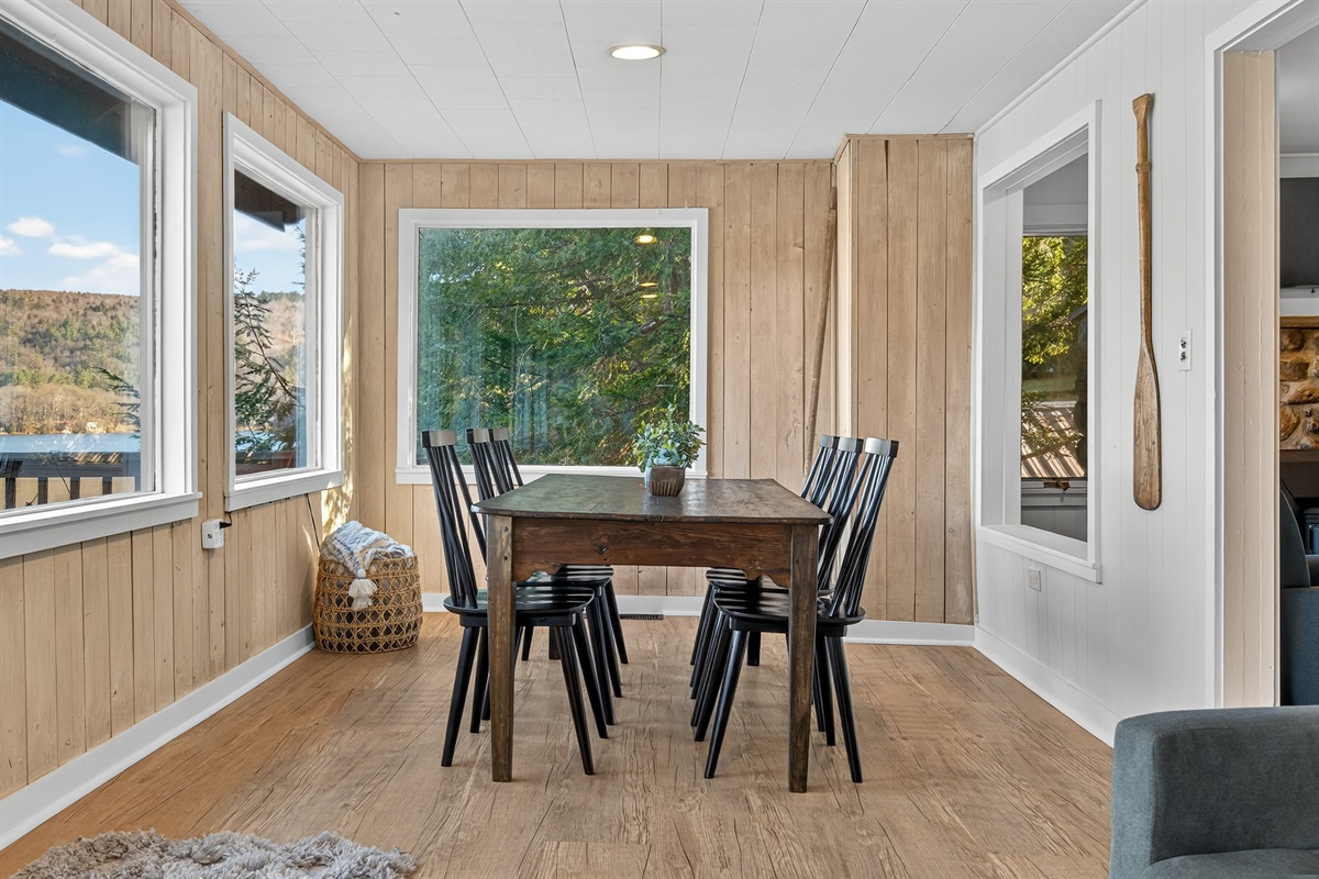 Dining area with large windows and lake views.
