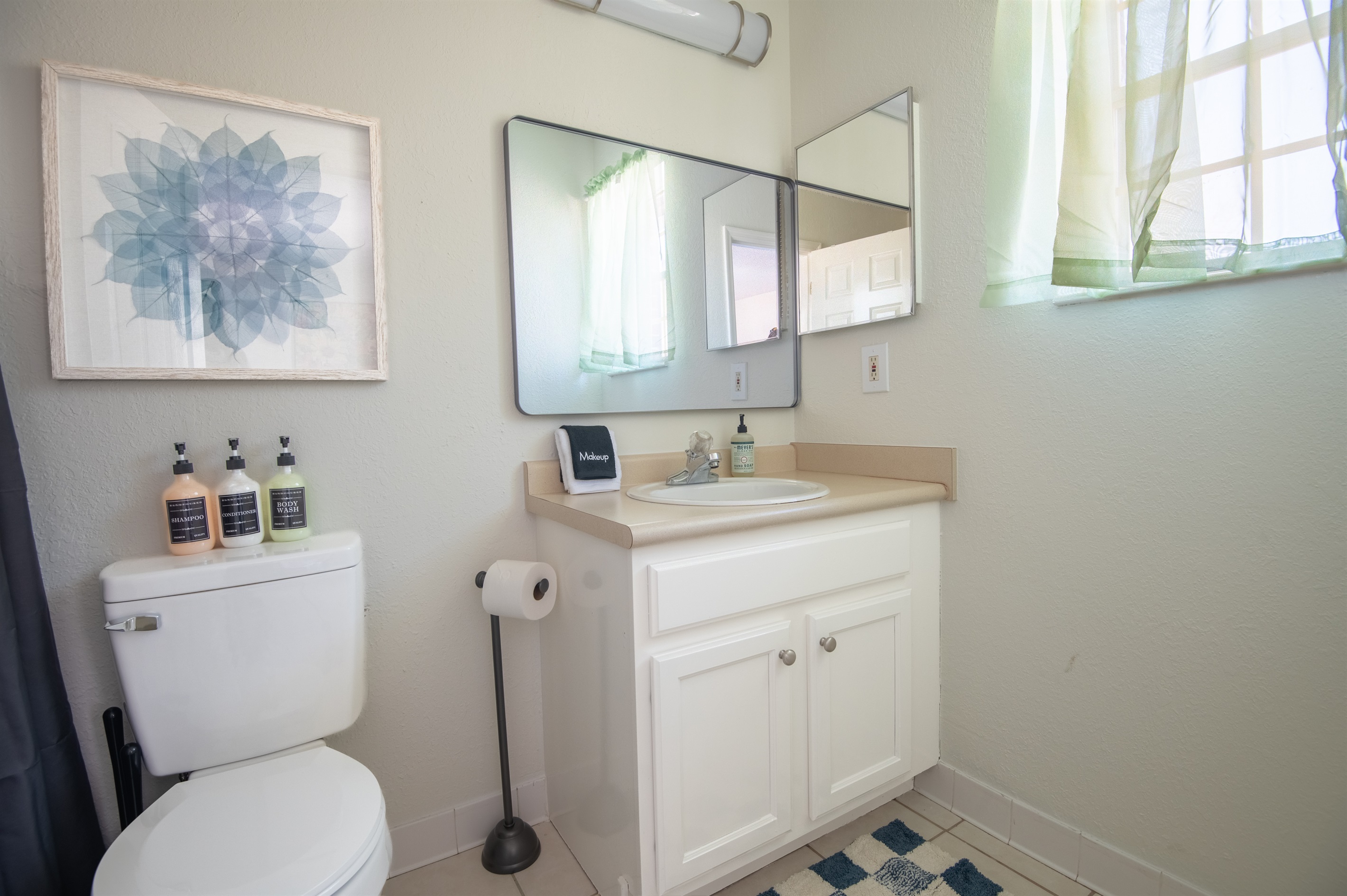 This ensuite bathroom is attached to the double queen bedroom featuring a shower and tub combination and all the essentials you need!
