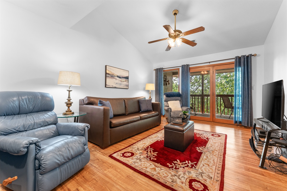 Natural light and deck access keep the living room bright and inviting throughout the day.