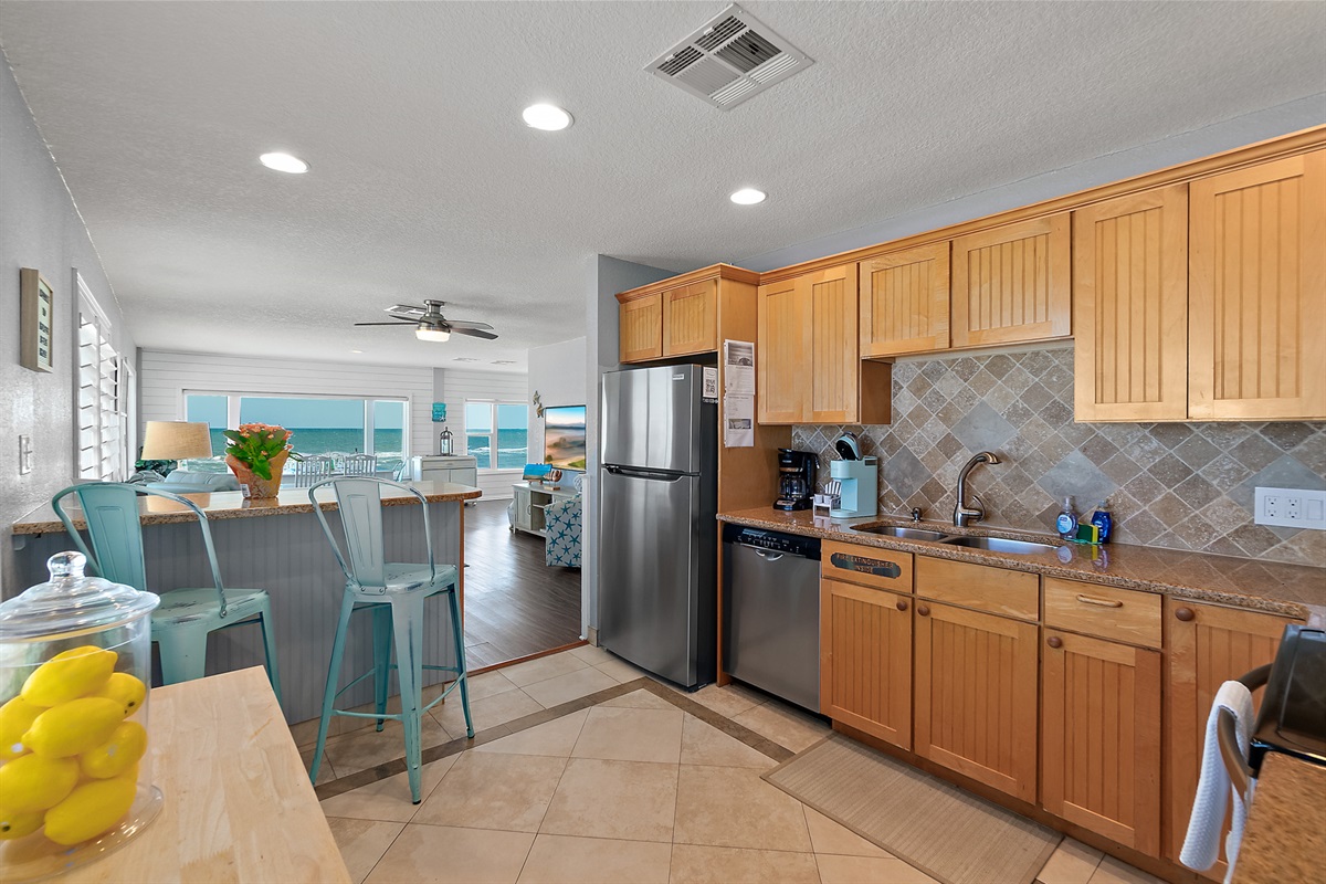 Bright kitchen and dining area with ocean light