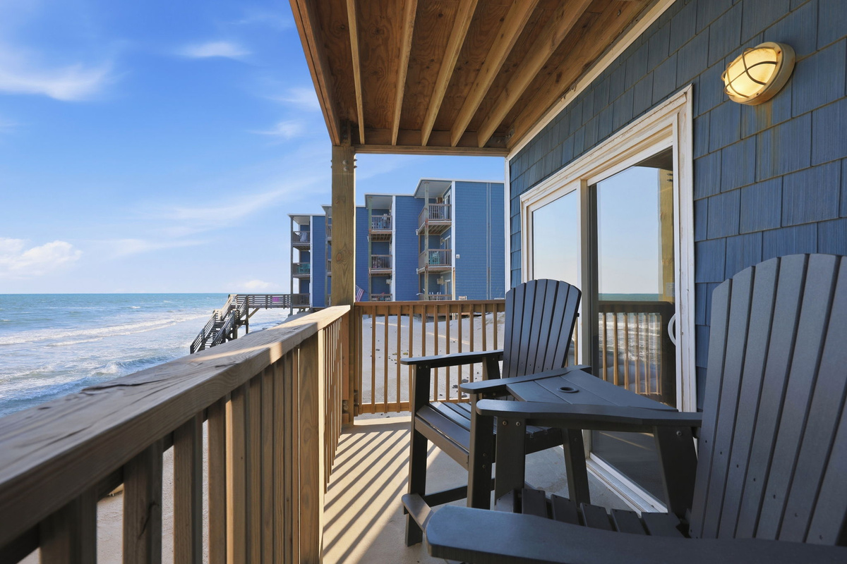 Spend your vacation steps from the water with a spacious balcony featuring comfortable seating and incredible views of the coastline