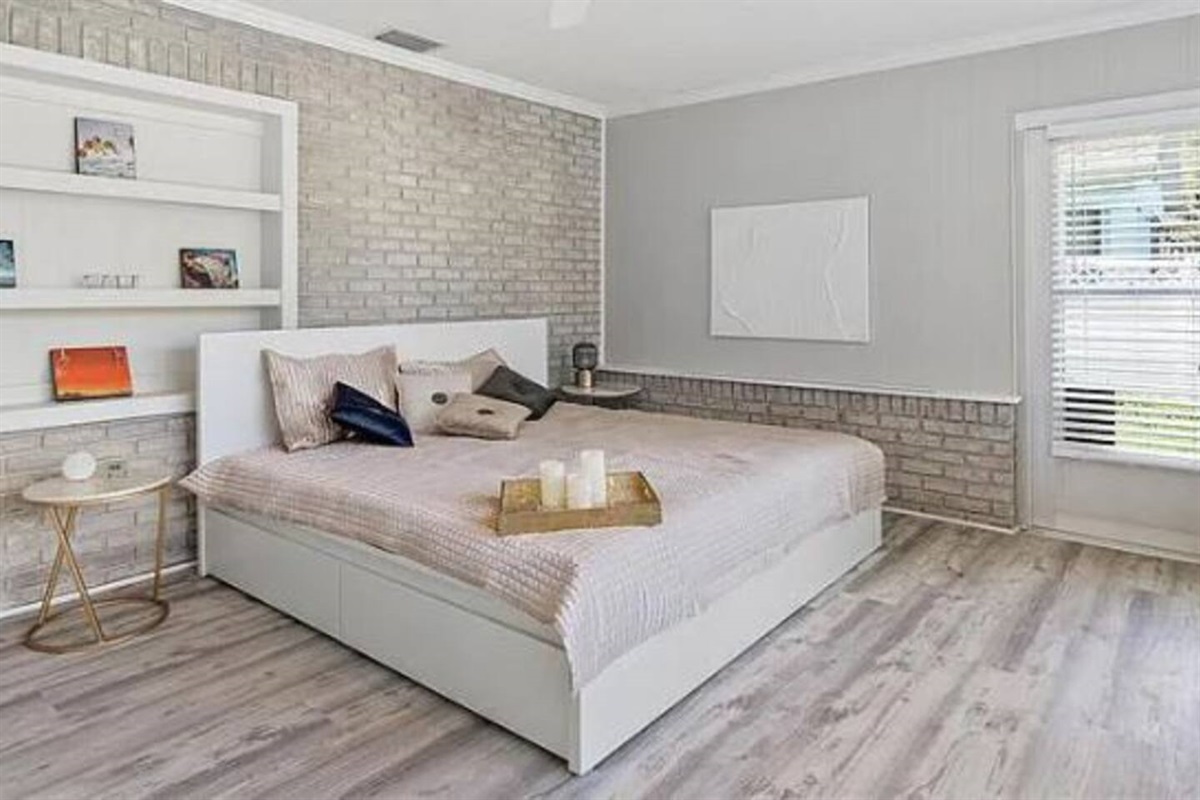 The master bedroom has a King bed and an unobstructed view of the water.