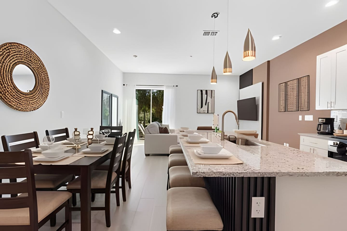 Cook in this modern kitchen with sleek countertops and top-notch appliances.