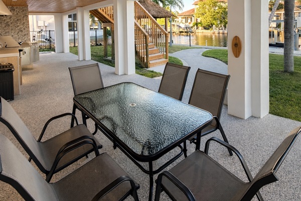 Dining next to BBQ, on the patio