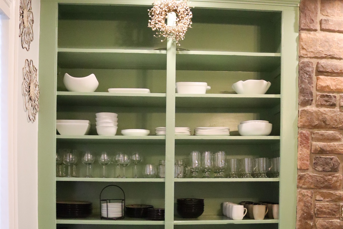 fully equipped kitchen with dishes