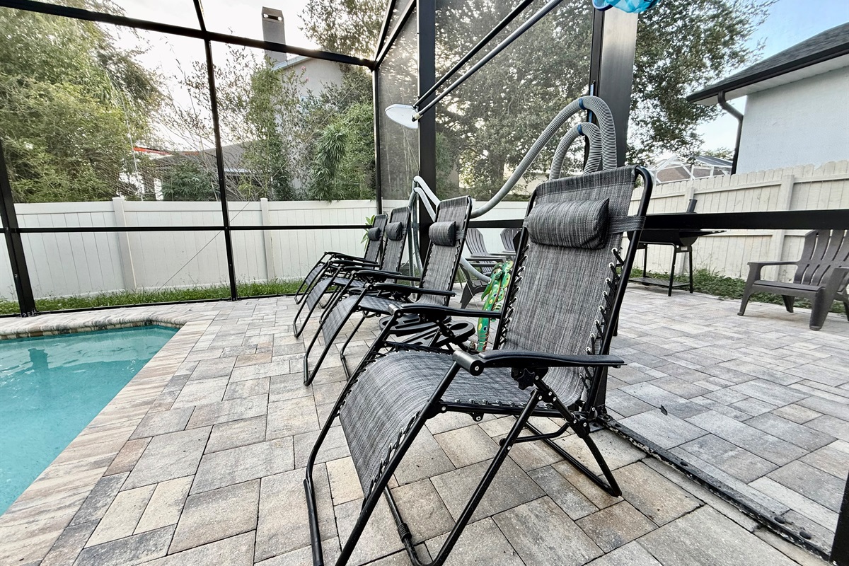 Stretch out and soak up the sun on multiple reclining loungers or gather around the shaded seating area for poolside conversations, card games, or reading a good book.