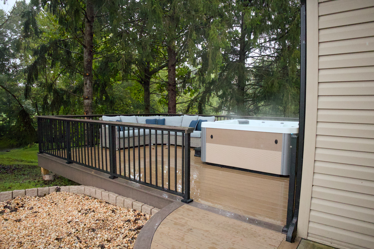 Outdoor living space tucked under the pines