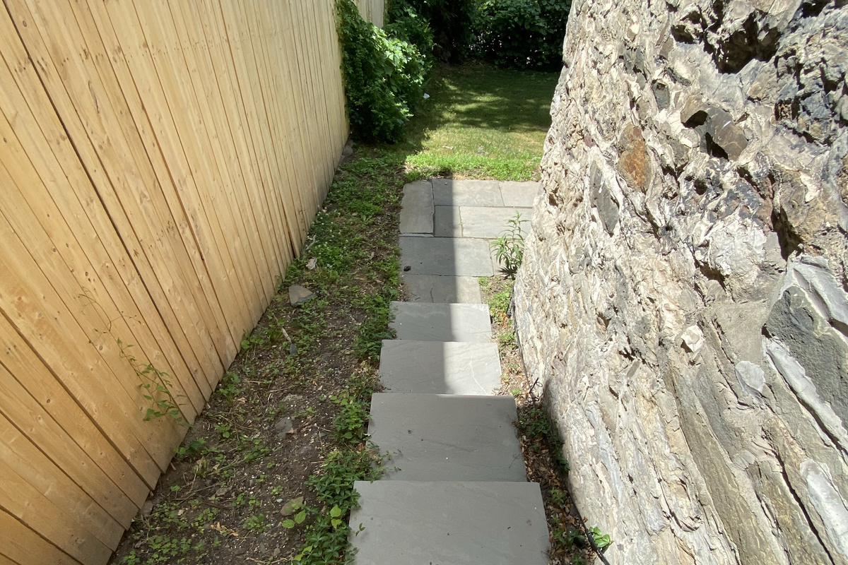 The bluestone path to the apartment