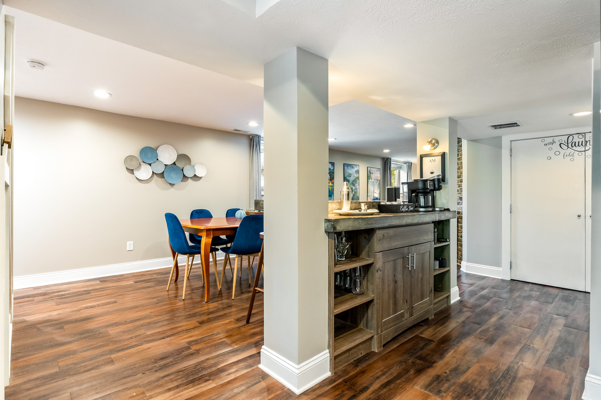 An open, functional layout. The dining space connects seamlessly to the dedicated coffee bar and breakfast counter, making it easy to serve morning meals or catch up on emails.