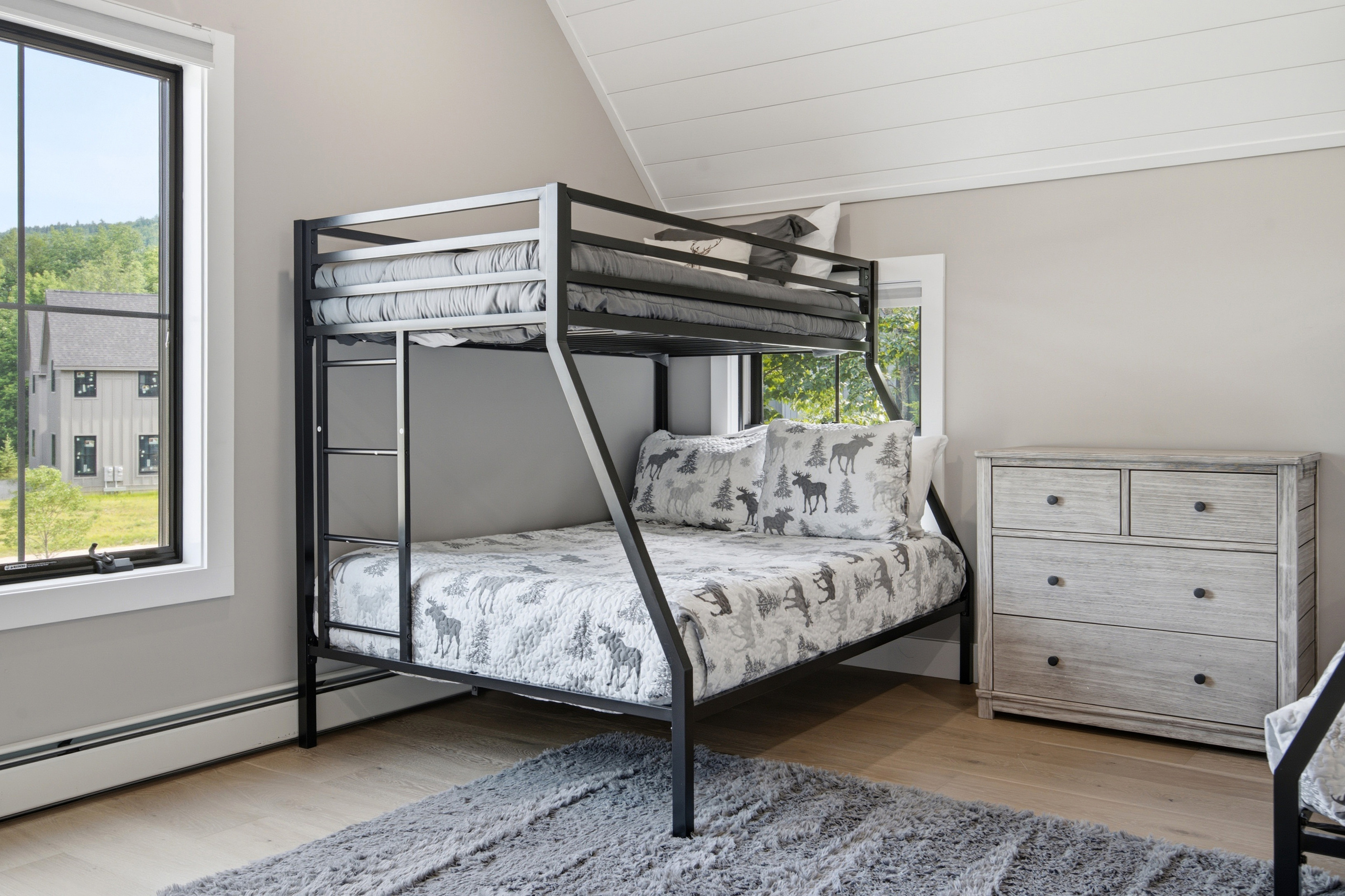 Wake up to natural light and peaceful views from this comfortable sleeping space.