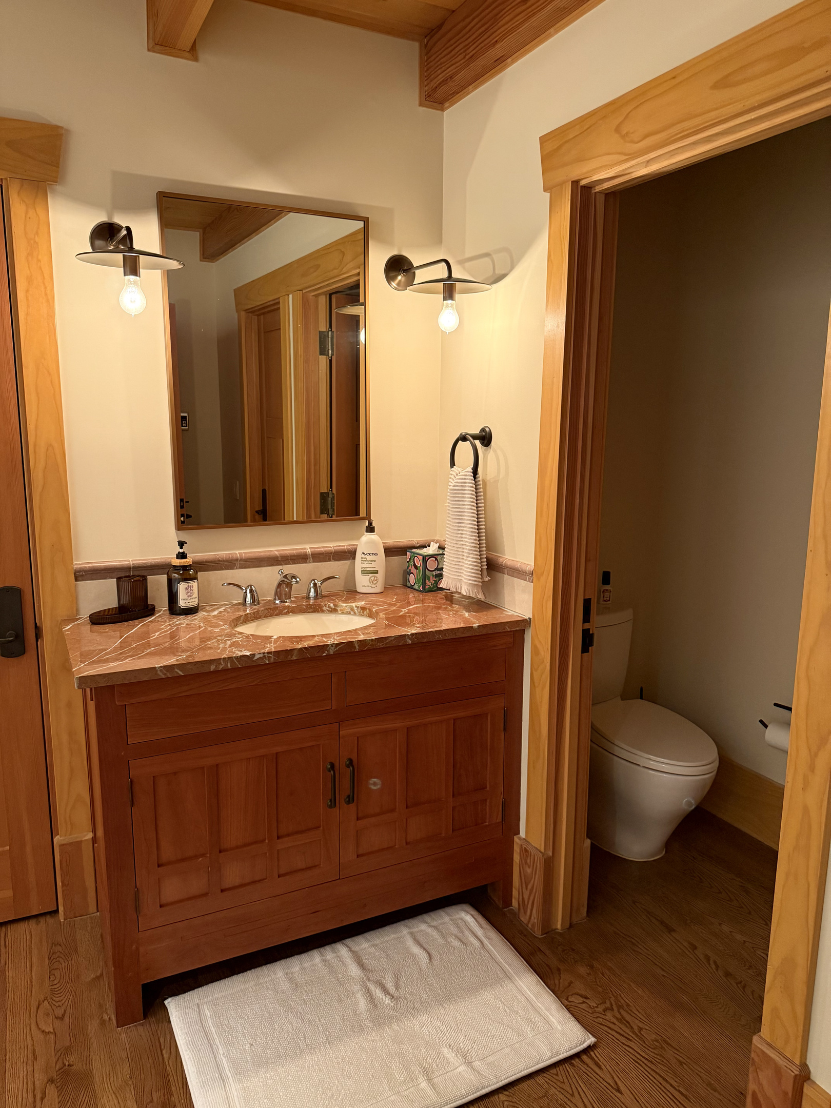The carriage house includes its own private bathroom, separate from the main house, with a soaking tub and a large walk-in shower for added comfort.