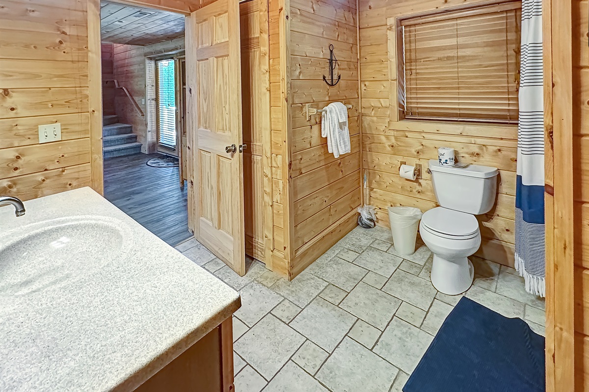 Bathroom: Bright with natural light, featuring rustic wood accents and modern amenities!