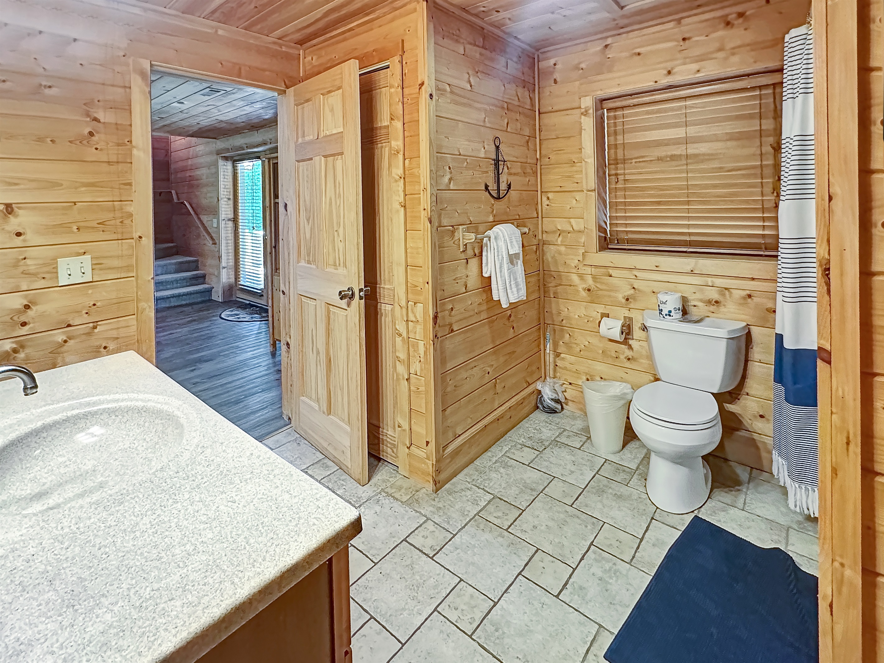 Bathroom: Bright with natural light, featuring rustic wood accents and modern amenities!
